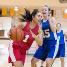 students playing basketball